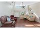 Spacious living room with a large sectional sofa and hardwood floors at 9822 Gulfstream Blvd, Englewood, FL 34224