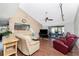 Spacious living room with hardwood floors and a large sectional sofa at 9822 Gulfstream Blvd, Englewood, FL 34224