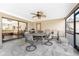 Screened patio with outdoor dining furniture and view of living room at 9822 Gulfstream Blvd, Englewood, FL 34224