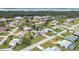 Wide aerial view of the neighborhood, showing nearby houses and waterways at 1035 Oleander St, Englewood, FL 34223