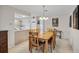 Bright dining room with wood table and kitchen views at 1035 Oleander St, Englewood, FL 34223