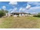 Spacious backyard with shed and grassy area at 11091 Corrigan Ave, Englewood, FL 34224