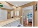 Bathroom with vanity and view of bedroom at 11091 Corrigan Ave, Englewood, FL 34224