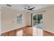 Well-lit bedroom with wood floors and sliding glass doors at 11091 Corrigan Ave, Englewood, FL 34224