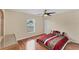 Spacious bedroom with wood floors and sliding glass doors at 11091 Corrigan Ave, Englewood, FL 34224
