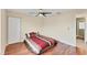 Simple bedroom with wood floors and access to bathroom at 11091 Corrigan Ave, Englewood, FL 34224