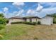 House exterior showcasing a shed and fenced backyard at 11091 Corrigan Ave, Englewood, FL 34224