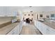 Eat-in kitchen with white cabinets, and a dining area at 11091 Corrigan Ave, Englewood, FL 34224