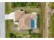 Bird's eye view of the house, highlighting its layout and pool at 116 Hercules Dr, Rotonda West, FL 33947