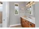 Small bathroom with wood vanity and tiled floor at 116 Hercules Dr, Rotonda West, FL 33947