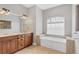 Bathroom features a soaking tub and double vanity at 116 Hercules Dr, Rotonda West, FL 33947