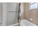 Bathroom with shower/tub combo and tile surround at 116 Hercules Dr, Rotonda West, FL 33947