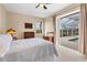 Bedroom with sliding doors opening to a lanai and pool at 116 Hercules Dr, Rotonda West, FL 33947