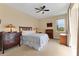 Guest bedroom with antique furniture and pool view at 116 Hercules Dr, Rotonda West, FL 33947