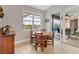 Bright breakfast nook with view of the pool and patio at 116 Hercules Dr, Rotonda West, FL 33947