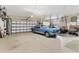 Spacious garage with classic car and storage at 116 Hercules Dr, Rotonda West, FL 33947