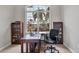 Bright home office features a large window and hardwood desk at 116 Hercules Dr, Rotonda West, FL 33947