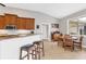 Kitchen with wood cabinets, granite countertops, and a breakfast nook at 116 Hercules Dr, Rotonda West, FL 33947