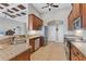 Spacious kitchen with stainless steel appliances and granite countertops at 116 Hercules Dr, Rotonda West, FL 33947
