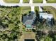 Aerial view showcasing home, pool, and surrounding landscape at 12063 Claremont Dr, Port Charlotte, FL 33981