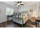 Cozy bedroom with antique bed and window seat at 12063 Claremont Dr, Port Charlotte, FL 33981
