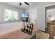 Spacious bedroom with TV, window, and cozy bedding at 12063 Claremont Dr, Port Charlotte, FL 33981