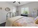 Charming bedroom with antique bed and plenty of natural light at 12063 Claremont Dr, Port Charlotte, FL 33981