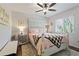 Bedroom with a rustic bed and a window with blinds at 12063 Claremont Dr, Port Charlotte, FL 33981