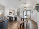 Dining area with a farmhouse table and chairs, leading to the kitchen at 12063 Claremont Dr, Port Charlotte, FL 33981