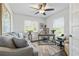 Spacious home office with a comfortable couch and large windows at 12063 Claremont Dr, Port Charlotte, FL 33981