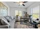 Bright home office features built-in shelving and large windows at 12063 Claremont Dr, Port Charlotte, FL 33981
