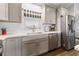 Modern kitchen featuring gray cabinets and stainless steel appliances at 12063 Claremont Dr, Port Charlotte, FL 33981