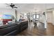 Open living space with leather sectional, hardwood floors, and dining area at 12063 Claremont Dr, Port Charlotte, FL 33981
