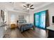Main bedroom with ensuite bathroom and access to a patio at 12063 Claremont Dr, Port Charlotte, FL 33981