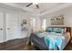 Main bedroom with ensuite bathroom and large windows at 12063 Claremont Dr, Port Charlotte, FL 33981