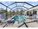 Screened pool and patio with plenty of space for relaxation at 12063 Claremont Dr, Port Charlotte, FL 33981