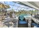Inviting pool area with patio furniture and screened enclosure at 12063 Claremont Dr, Port Charlotte, FL 33981