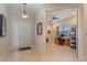 Bright and airy entryway with tile floors, leading to an office and entry door at 13048 Creekside Ln, Port Charlotte, FL 33953