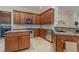 Modern kitchen with stainless steel appliances, granite countertops, and wooden cabinets at 13048 Creekside Ln, Port Charlotte, FL 33953