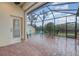 Screened patio with brick pavers and outdoor seating at 13048 Creekside Ln, Port Charlotte, FL 33953