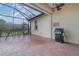 Screened patio with brick pavers and grill at 13048 Creekside Ln, Port Charlotte, FL 33953