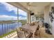 Spacious balcony with outdoor dining furniture and water views at 13213 Gasparilla Rd # B601, Placida, FL 33946
