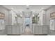 Double vanity bathroom with a spacious layout and elegant fixtures at 13213 Gasparilla Rd # B601, Placida, FL 33946