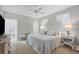 Calm bedroom with white bedding and ornate headboard at 13213 Gasparilla Rd # B601, Placida, FL 33946