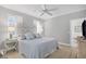 Serene bedroom with white bedding and ornate headboard at 13213 Gasparilla Rd # B601, Placida, FL 33946
