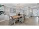 Elegant dining room with a wooden table and wicker chairs at 13213 Gasparilla Rd # B601, Placida, FL 33946