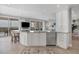 Bright kitchen with island, stainless steel appliances, and water views at 13213 Gasparilla Rd # B601, Placida, FL 33946