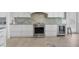 Modern kitchen features stainless steel appliances and granite countertops at 13213 Gasparilla Rd # B601, Placida, FL 33946
