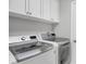 Convenient laundry room with front-load washer and dryer at 13213 Gasparilla Rd # B601, Placida, FL 33946