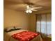 Cozy bedroom with ceiling fan and window coverings at 13537 Bennett Dr, Port Charlotte, FL 33981